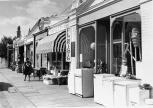 Single storey shop fronts, part of the original 1893 market building, photographed in 1976
; image provided by Chiswick Public Library